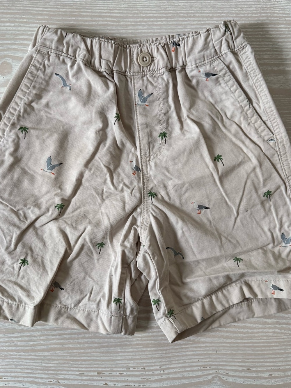 Uniqlo boys khaki shorts with birds and palm trees